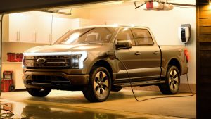 2022-Ford-F-150-Lightning-Platinum-Exterior-009-front-three-quarters-in-garage-after-storm