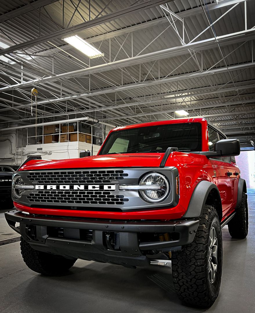 Red 2022 Bronco Badlands Parked in Service at Bill Brown Ford in Livonia, MI